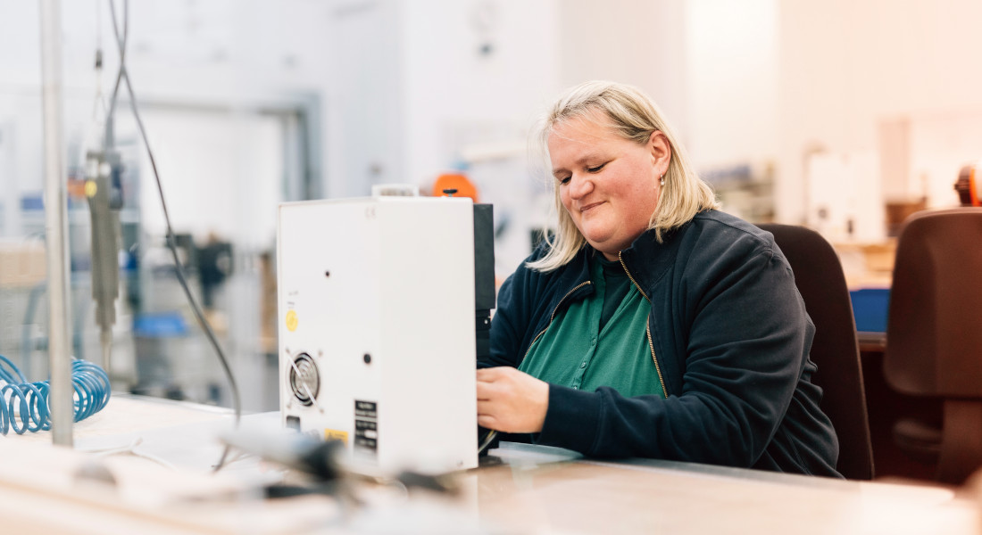 Woman assembling cable, EFB-Elektronik