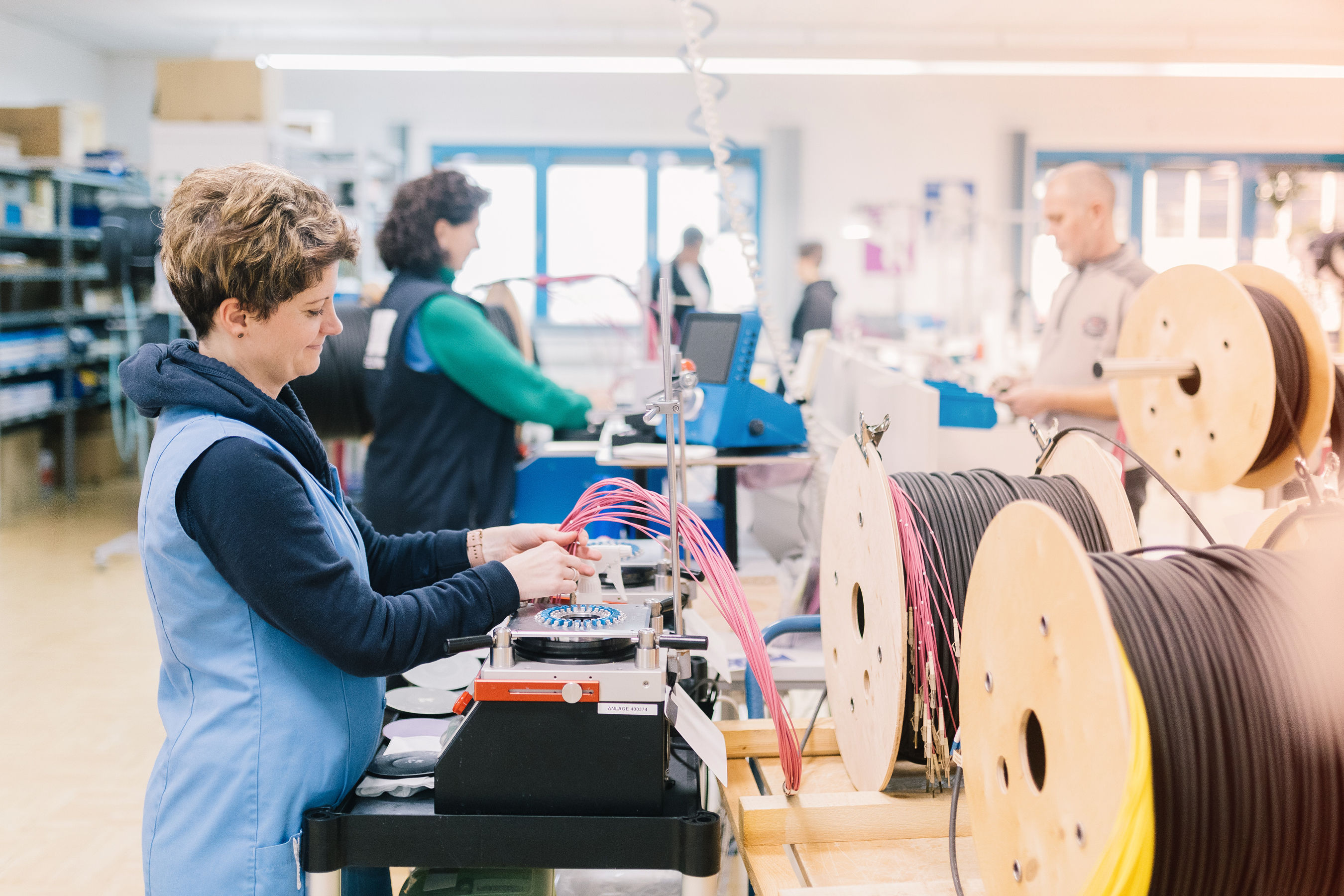 Woman assembling cable, EFB-Elektronik