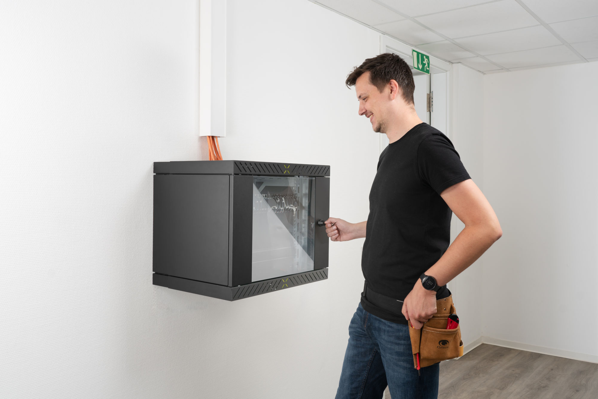 Man opens the door of the X-Rack Man opens the door of the X-Rack