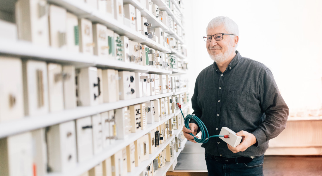 Man inspecting cable test-devices, EFB-Elektronik