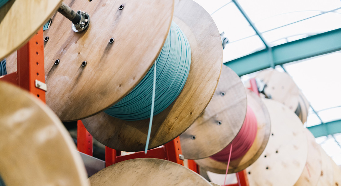 Cable drums with fiber optic cables in a warehouse Cable drums with fiber optic cables in a warehouse